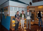 Rich McCrea, Carolyn Golightly, Dr. Phil Currie pose in front of the new Museum exhibit, opened on 3 July 2003.