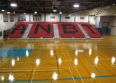 Russell Gamble Gymnasium bleachers with the All Native Basketball Tournament (ANBT) Letters