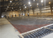 Works laying the new cement floor in the Dease Lake Recreation Centre.