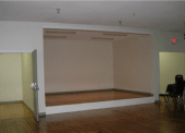 The expansion of the hall included the addition of a stage, storage area, and exit.