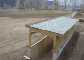 A newly constructed dugout looking out over the new baseball field.