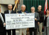 Holding the cheque (from left to right): Matt Reid (Associate Professor - Physics), Don Cozetto (UNBC past president), Dick Harris (MP), and Bruce Sutherland (Former Chair of the NDIT Board). Bruce Sutherland of Wolftek Industries was instrumental in getting this project started back in 2006 with Wolftek. This was a cheque for the full CEDI project that led to the prototype. Holding the cheque (from left to right): Matt Reid (Associate Professor - Physics), Don Cozetto (UNBC past president), Dick Harris (MP), and Bruce Sutherland (Former Chair of the NDIT Board). Bruce Sutherland of Wolftek Industries was instrumental in getting this project started back in 2006 with Wolftek. This was a cheque for the full CEDI project that led to the prototype.