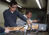 Dian Wang (left, Engineer hired under the CEDI project) and Matt Reid installing and testing the new THz scanning equipment in the research laboratory at Deltech Manufacturing Inc. This was the location where the full prototype scanning system was developed and tested here in Prince George. Dian Wang (left, Engineer hired under the CEDI project) and Matt Reid installing and testing the new THz scanning equipment in the research laboratory at Deltech Manufacturing Inc. This was the location where the full prototype scanning system was developed and tested here in Prince George.